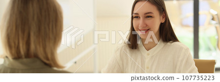 Positive manager conducts job interview with woman in office 107735223