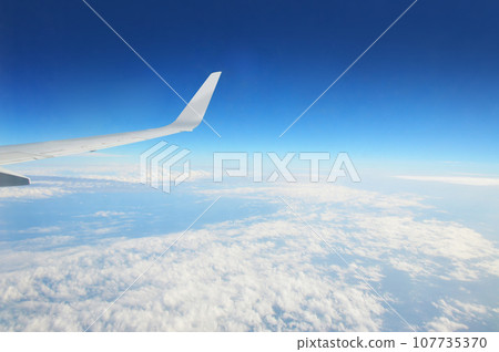 Aerial view of blue sky and clouds from an airplane Aerial view of blue sky and clouds from an airplane 107735370