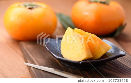 Very sweet taste of autumn Persimmon Fruit (Wood grain background) Persimmon fruit 107735438