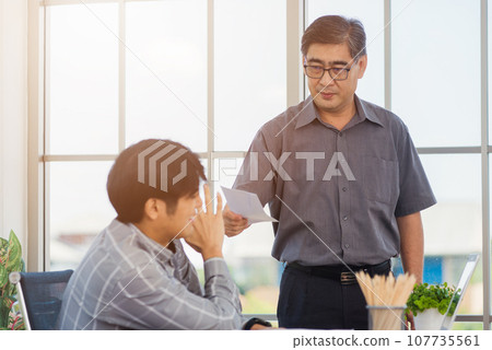 Asian businessman anti bribery and corruption he rejecting money in white envelope offered by partner. Business man sending resignation letter to employee the business downturn to laid off at office 107735561