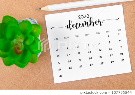 The December 2023 Monthly calendar for 2023 year with wooden pencil on wooden table. The December 2023 Monthly calendar for 2023 year with wooden pencil on wooden table. 107735844