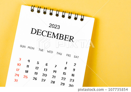 The December 2023 Monthly desk calendar for 2023 year on yellow background. The December 2023 Monthly desk calendar for 2023 year on yellow background. 107735854