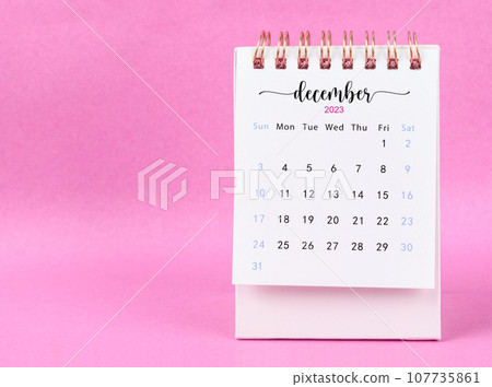 The December 2023 desk calendar for 2023 year on pink color background. The December 2023 desk calendar for 2023 year on pink color background. 107735861