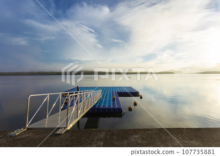 Tourism port in the colorful sunrise at Ban Sam Chong Tai, Phang nga, Thailand. 107735881
