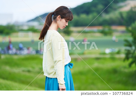 Young woman blue sky park Young woman blue sky park 107736824