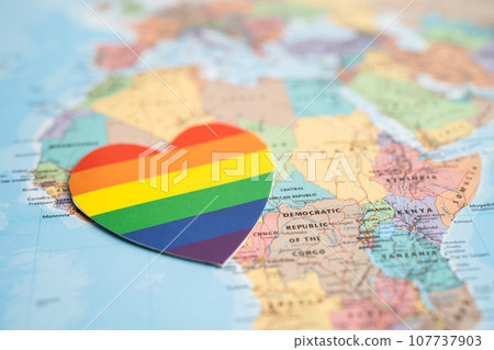 Bangkok, Thailand, June 1, 2022 Rainbow color heart on globe world map background, LGBT pride month celebrate annual in June, symbol of gay, lesbian, bisexual, transgender, human rights and peace. Bangkok, Thailand, June 1, 2022 Rainbow color heart on globe world map background, LGBT pride month celebrate annual in June, symbol of gay, lesbian, bisexual, transgender, human rights and peace. 107737903