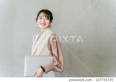 Stylish designer businesswoman with a laptop 107738720