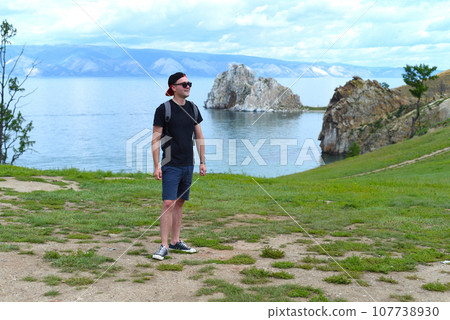 Russian tourist near holy place among shamans Shamanka. Lake Baikal, Olkhon. Russian tourist near holy place among shamans Shamanka. Lake Baikal, Olkhon. 107738930