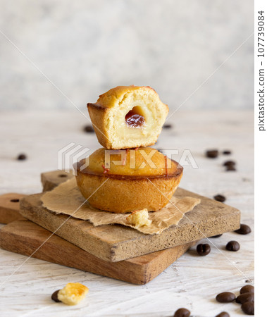 Pasticciotto leccese pastry filled with egg custard cream and sour cherry jam close up 107739084