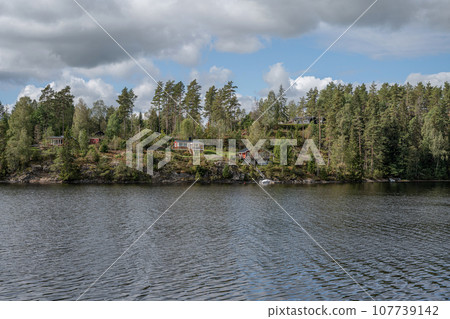 Lake Ragnerudssjoen in Dalsland Sweden beautiful nature forest pinetree swedish houses 107739142
