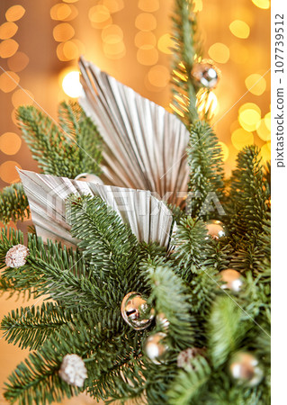Floral arrangement in a round box with a live spruce for decorating the house for the Christmas holidays. Christmas wooden box with fir branches for the holiday. The new year celebration. European Floral arrangement in a round box with a live spruce for decorating the house for the Christmas holidays. Christmas wooden box with fir branches for the holiday. The new year celebration. European 107739512