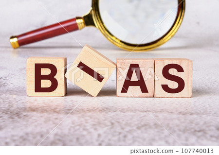 Bias a word written on wooden cubes Bias a word written on wooden cubes 107740013