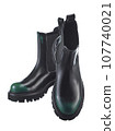 Beautiful pair of high demi-season boots made of black leather with a green spout, with a massive sole, isolated on a white background. 107740021