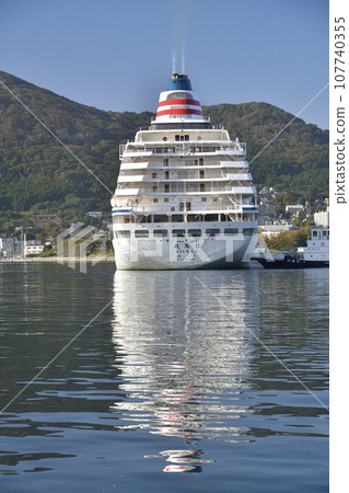 Photographing the scenery of the cruise ship Asuka II calling at Hakodate Port in Hakodate City, Hokkaido in autumn. 107740355