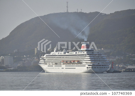 Photographing the scenery of the cruise ship Asuka II calling at Hakodate Port in Hakodate City, Hokkaido in autumn. 107740369