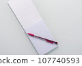 Top view of blank notebook with pencil on white background 107740593