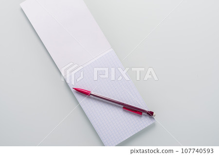 Top view of blank notebook with pencil on white background 107740593