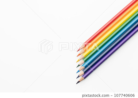 Rainbow color pencils in the form of an arrow from the right corner top view Rainbow color pencils in the form of an arrow from the right corner top view 107740606