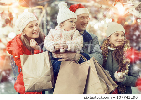 Parents and daughters at Christmas fair 107742196
