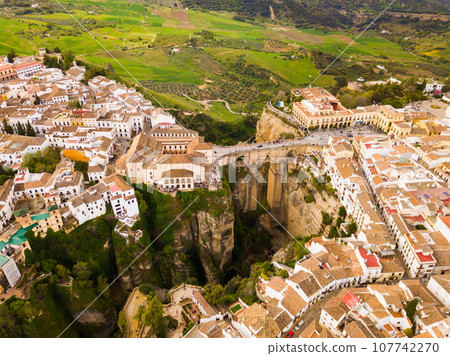 Ronda landscape and buildings with Puente Nuevo Bridge, Andalusia, Spain 107742270