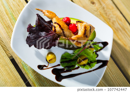 Tasty fried legs of quail served with vegetables and balsamic pasta Tasty fried legs of quail served with vegetables and balsamic pasta 107742447