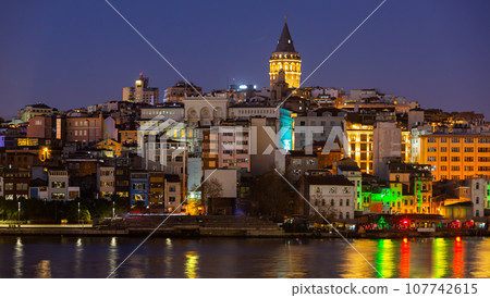 Karakoy and Galata Tower from Golden Horn Bay in twilight, Istanbul, Turkey 107742615