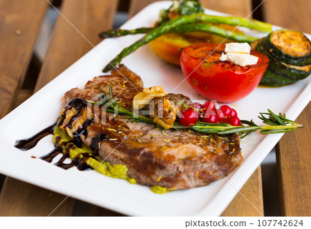 Veal with grilled vegetables 107742624