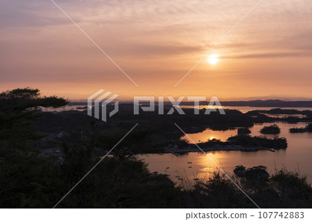 Sunset seen from Otaka Forest, Matsushima, Miyagi Prefecture, one of Japan's three most scenic views Sunset seen from Otaka Forest, Matsushima, Miyagi Prefecture, one of Japan's three most scenic views 107742883