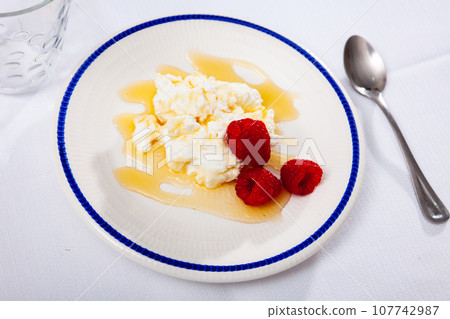 Portion of tradicional Catalan dessert, mato with honey Portion of tradicional Catalan dessert, mato with honey 107742987