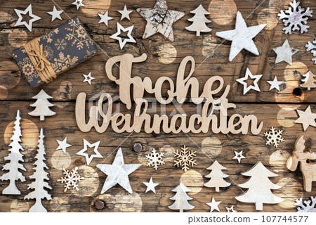 German Text Frohe Weihnachten, Means Merry Christmas In English, Flatlay German Text Frohe Weihnachten, Means Merry Christmas In English, Flatlay 107744577