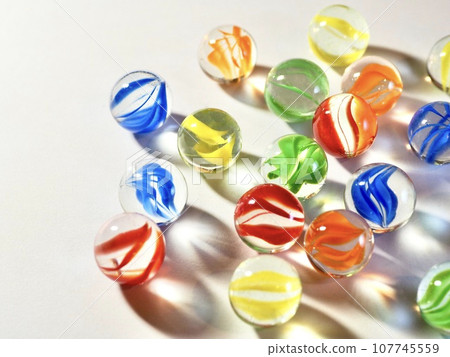 many marbles on white background many marbles on white background 107745559