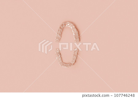Transparent Dental Clear Aligners on Beige. Invisible Braces. Prevention Gum Treatment. Retainers for Dentistry Correction. Invisalign Orthodontics concept. Alignment of Teeth. Dentofacial Orthopedics Transparent Dental Clear Aligners on Beige. Invisible Braces. Prevention Gum Treatment. Retainers for Dentistry Correction. Invisalign Orthodontics concept. Alignment of Teeth. Dentofacial Orthopedics 107746248