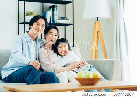 Young woman relaxing in the living room 107746267