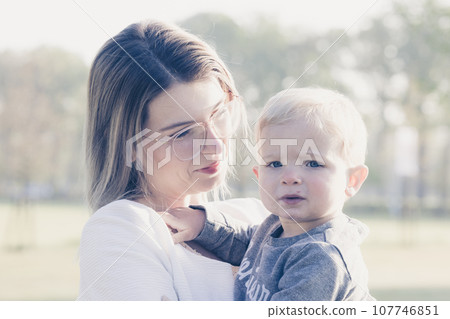 Morning Bliss: Mother and Child in Park Morning Bliss: Mother and Child in Park 107746851