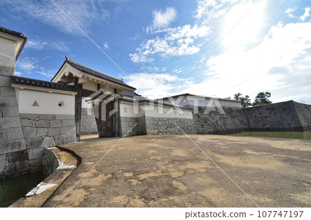 Main gate of Ako castle ruins with blue sky background Main gate of Ako castle ruins with blue sky background 107747197