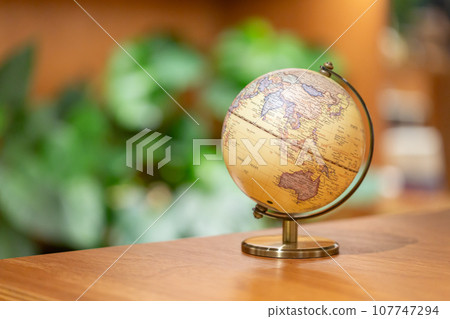 Globe with green background Global image 107747294