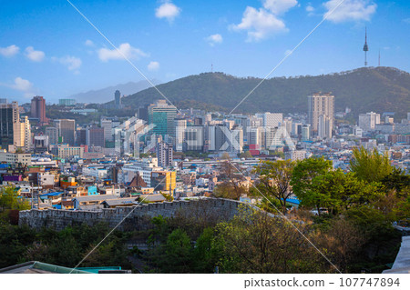 Cityscape of Seoul and skyscrapers in Dongdaemun area There is Namsan Mountain in the background, South Korea. Cityscape of Seoul and skyscrapers in Dongdaemun area There is Namsan Mountain in the background, South Korea. 107747894
