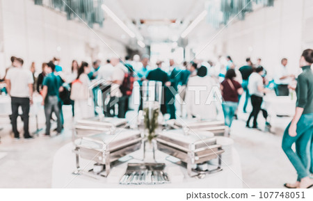 Blured image of businesspeople at coffee break at conference meeting. Business and entrepreneurship. 107748051