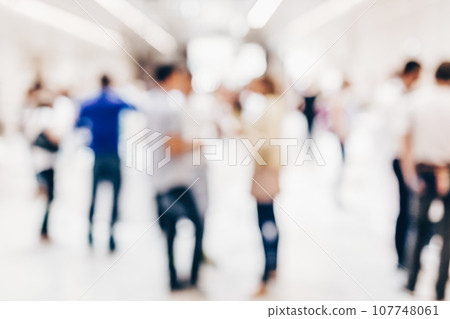 Abstract blurred people socializing during coffee break at business meeting or conference. 107748061