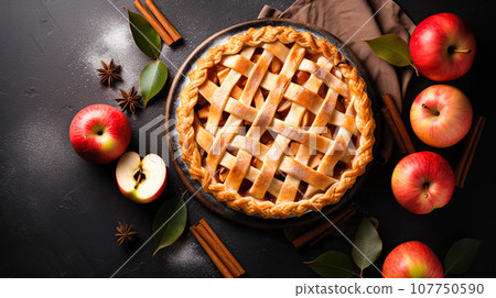 Festive American apple pie dark background. Festive sweet dessert for Thanksgiving, pie day. Top view with copy space 107750590