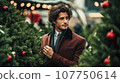 A handsome businessman in suit chooses a fir tree at the city Christmas market. generated  AI 107750614