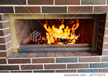 An open fire in a brick oven or barbecue An open fire in a brick oven or barbecue 107752875