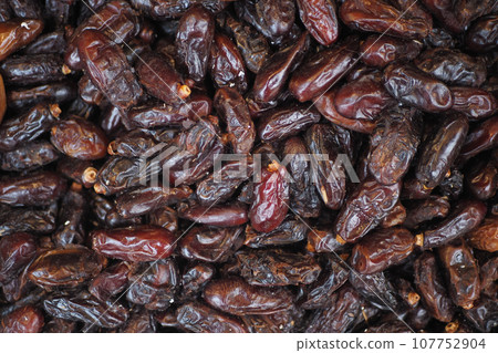 many date fruits display for sale at local market  107752904