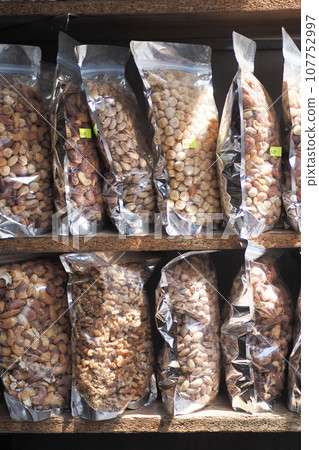 close up of many mixed nuts in packet at shelf close up of many mixed nuts in packet at shelf 107752997
