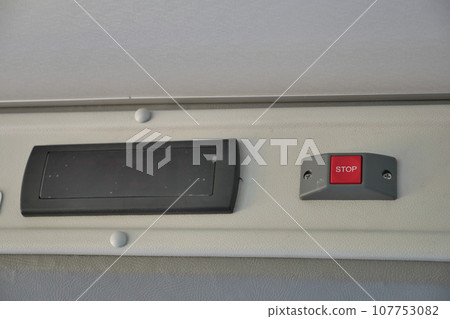Closeup of Bus bell switch for stop inside the public bus 107753082