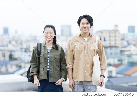 Young men and women college students 107756540