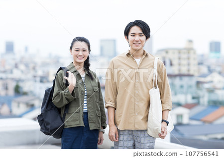 Young men and women college students 107756541