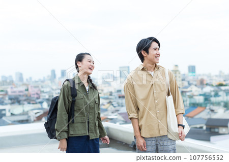 Young men and women college students 107756552