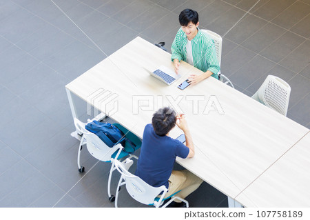 college student using laptop 107758189