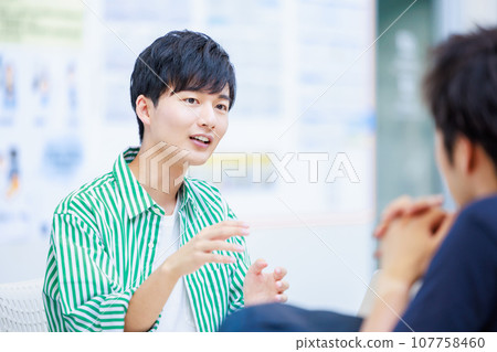 college student talking with friends 107758460